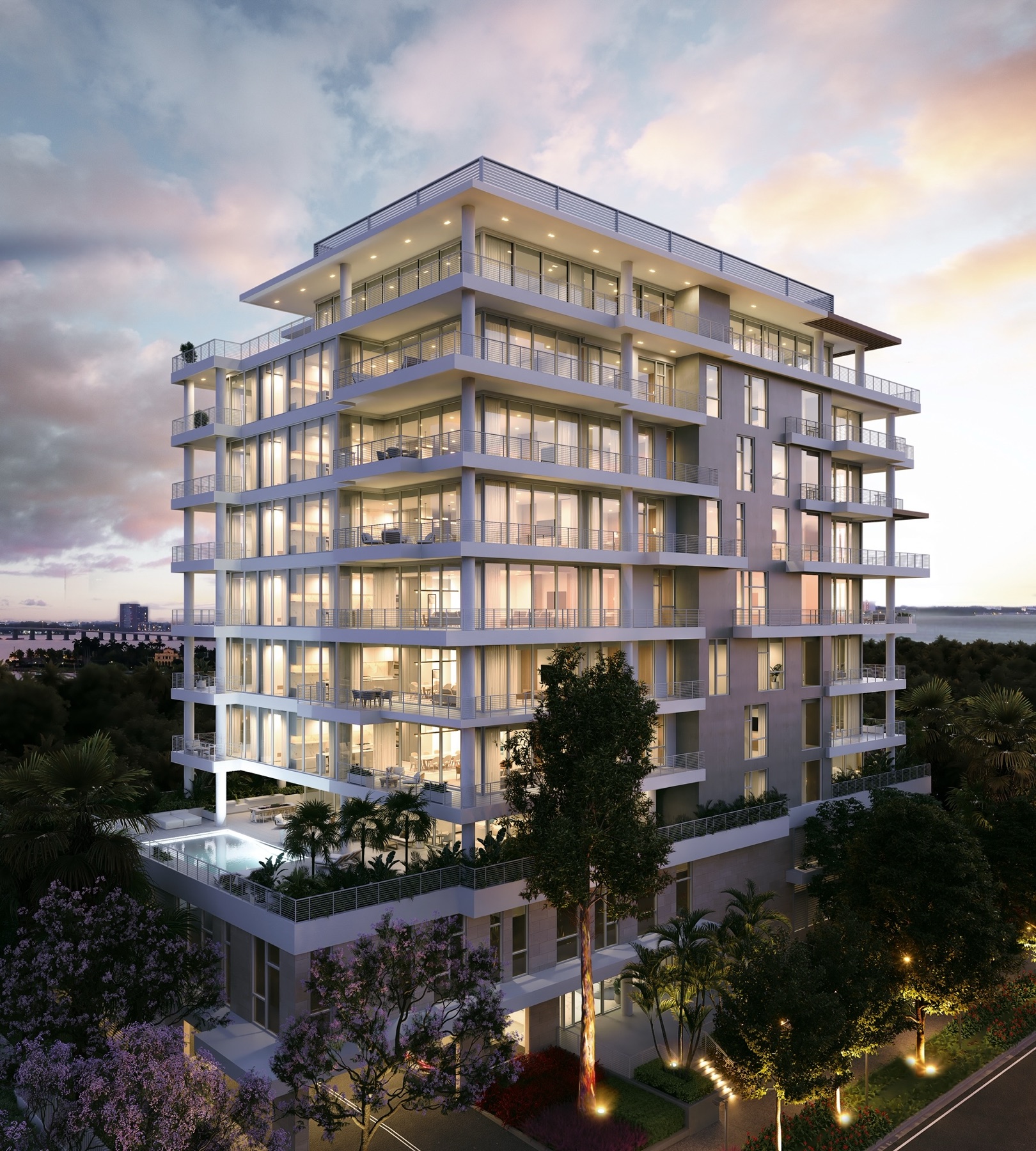 The Terraces Fort Lauderdale Beach at twilight — a ten-story boutique condominium with staggered, architecturally cantilevered private terraces and warm-lit corner residences at 527 Orton Avenue. Developed by Group Latitude.
