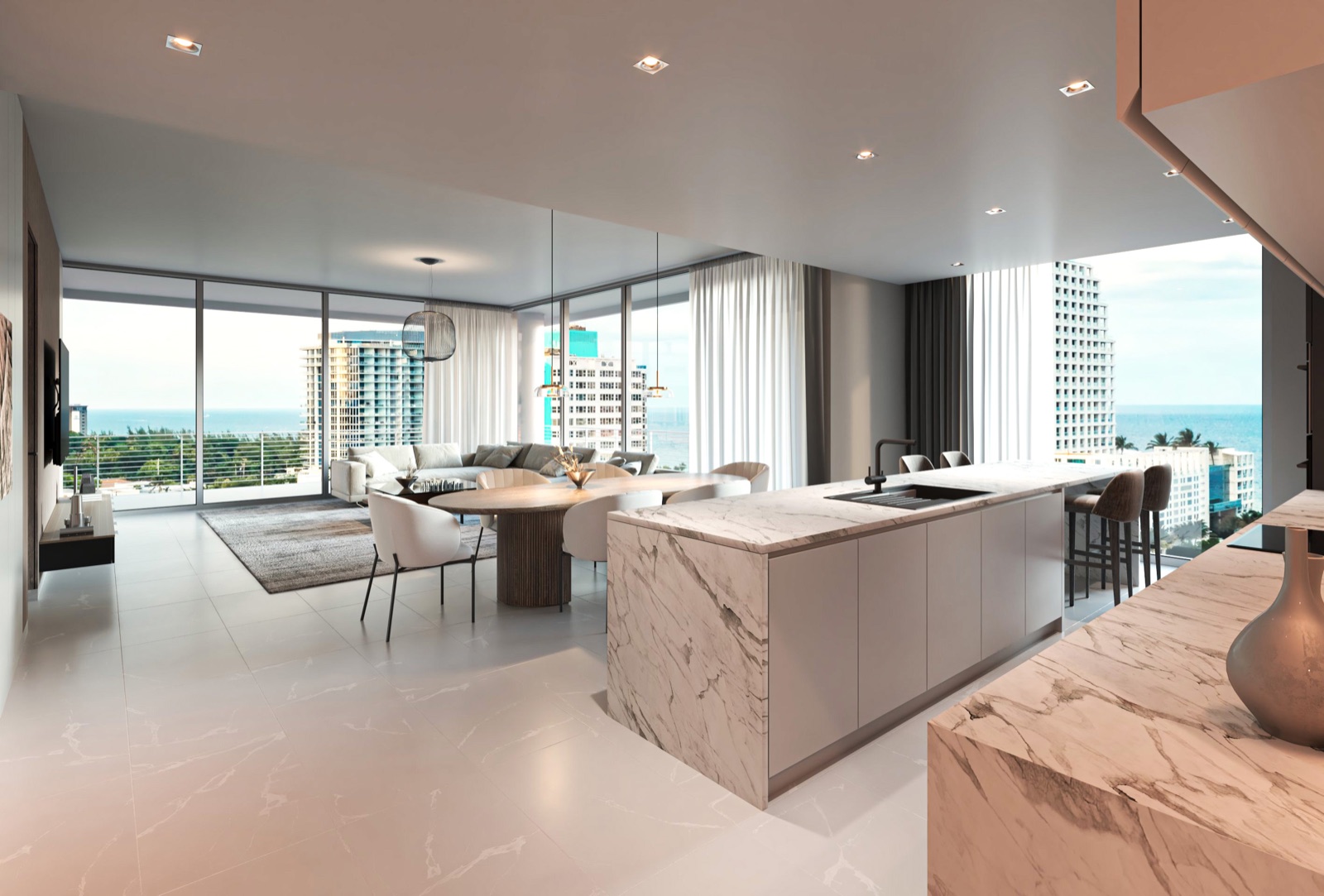 Kitchen at The Terraces Fort Lauderdale Beach — a European quartz waterfall island, bespoke contemporary cabinetry, and Sub-Zero and Bosch appliances, opening to the dining area and a wrap-around terrace with ocean views.